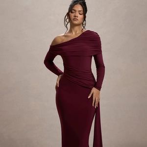 Detail of the asymmetrical neckline and elegant ruching on the burgundy evening dress