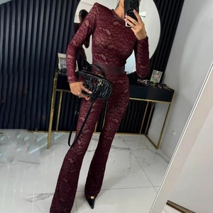 Wine red lace bodysuit set with long sleeves, flared pants and wide waist belt