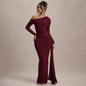 Detail of burgundy off-shoulder dress featuring elegant ruching and long sleeve ribbon