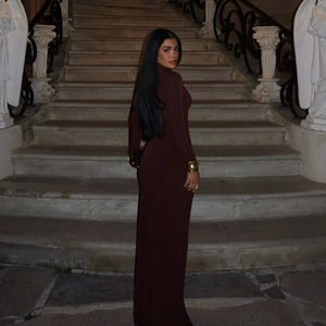 Detailed view of high-neck slim fit long dress with elegant open back design