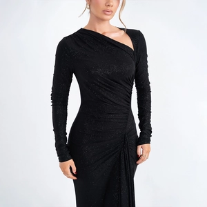 Detail showing asymmetric neckline and glitter fabric texture of the black slim dress