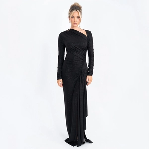 Detail of black glitter gown with side ruching and elegant thigh-high slit texture