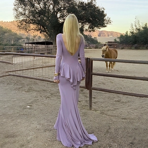 Elegant lavender backless maxi dress with ruffles and high slit in outdoor horse ranch