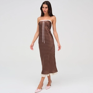 Brown polka dot tube maxi dress with pink lace trim and bow on a slim fit satin gown