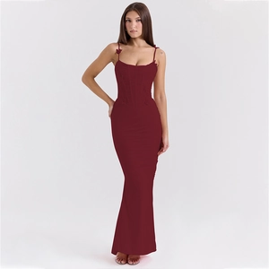 Close-up of wine red bodycon dress featuring corset-style gathering and ruched details