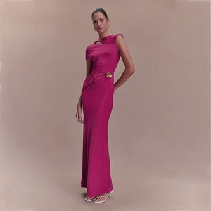 Elegant magenta bodycon maxi dress with asymmetrical neckline and golden floral brooch detail