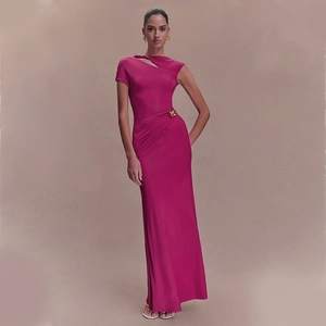 Detail of rose red maxi dress showing ruched waist and golden flower buckle ornament