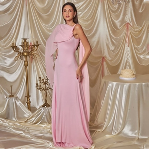 Detail of pink one-shoulder evening gown featuring elegant pleats and long ribbon streamers