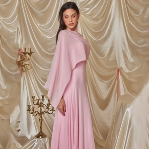 Elegant pink slim fit evening gown with chiffon capelet design against golden backdrop