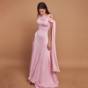 Detail of elegant pink sleeveless evening gown featuring a long flowing shoulder streamer