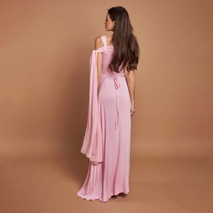 Elegant pink off-shoulder long dress with flowing sash and waist tie for formal events