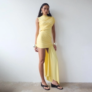 Detail view of the ruched light yellow slim fit mini dress with asymmetric long tail streamer