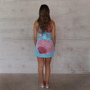 Slim fit backless sky blue slip mini dress with large pink scallop shell print for summer