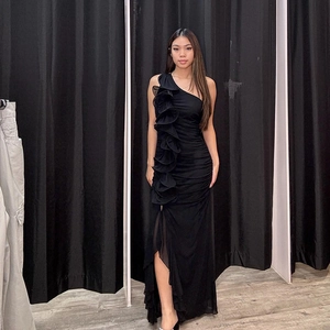 Elegant black one shoulder maxi dress with ruffles, side slit and textured ruching details