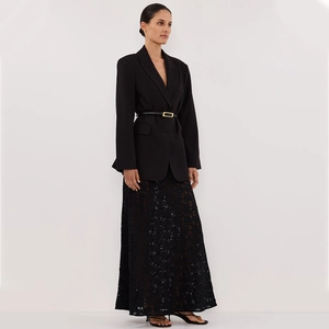 Elegant two-piece set featuring a black blazer with waist belt and a lace maxi skirt
