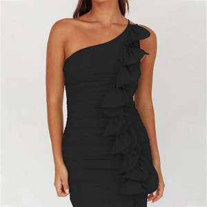 Detail of elegant black one-shoulder dress featuring ruched fabric and side ruffles