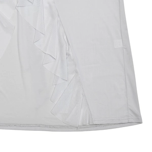Detail of the ruffle hem and fine stitching on a sleek light gray summer dress fabric
