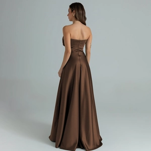 Detailed view of elegant chocolate brown satin evening gown with strapless backless design