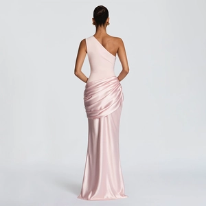 Detail of pink satin fishtail dress featuring elegant side pleats and smooth fabric sheen