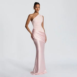 Detail of light pink one-shoulder dress with elegant pleats and satin fishtail hem