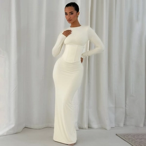 Close-up of white long sleeve maxi dress featuring corset waist and elegant slim fit