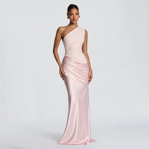 Detail of elegant pink one-shoulder mermaid dress with satin panel and ruched waist design