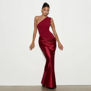 Close-up of asymmetric one-shoulder evening dress with pleated bodice and satin skirt