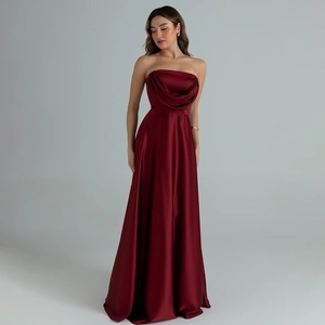 Detail of the elegant wine red satin dress showing the strapless draped neckline and fabric