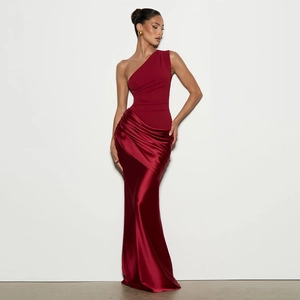 Detail of burgundy one-shoulder dress showing contrast matte and satin fabric panels