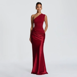 Detail of burgundy one-shoulder satin evening dress with pleated bodice and fishtail hem