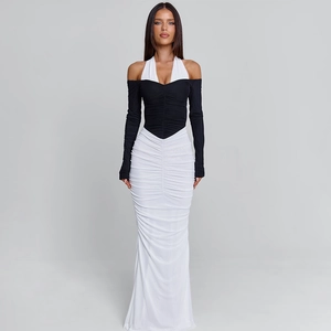 Detail of elegant two-tone dress showing ruched texture and halter neckline design