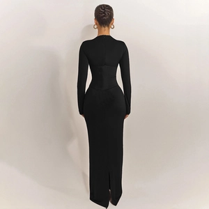Detail view of the back slit and waist structure on a black slim fit maxi dress
