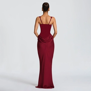 Back view of wine red satin evening gown featuring thin straps and back draped detailing