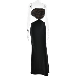 Detail of elegant black floor-length dress with lace splicing and waist cut-outs