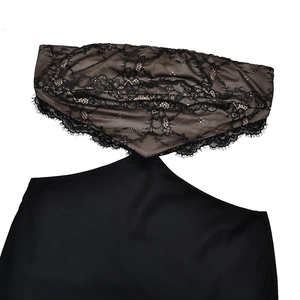 Detail view of black eyelash lace stitching and geometric cutout on long dress