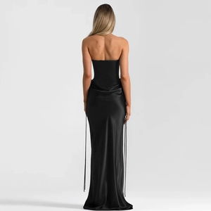 Detail of elegant black satin floor-length dress featuring a slim fit and open back design