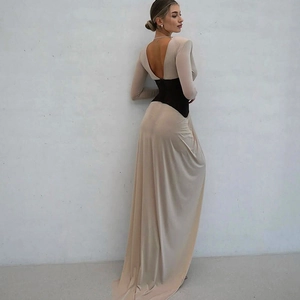Detail of slim fit long sleeve maxi dress featuring nude color block and open back design