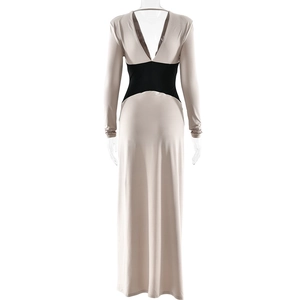 Detail of slim fit backless maxi dress with deep V-neck and nude color block design