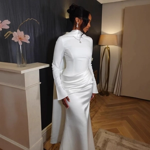 Elegant white satin high neck long sleeve gown with asymmetric pleated fishtail design