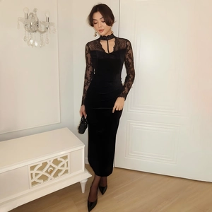 Elegant slim fit black velvet dress featuring lace sleeves and a hollow halter neckline