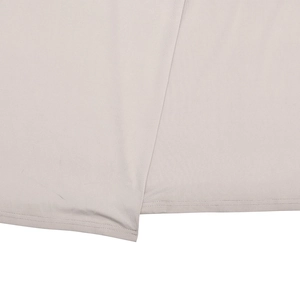 Detail of double-needle flat seam stitching on light gray slim fit dress hemline