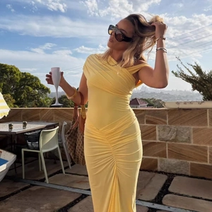Ruched pale yellow bodycon maxi dress with an asymmetrical one-shoulder neckline