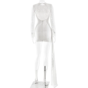 Detail of white lace mini dress featuring open back design and side ribbon streamers