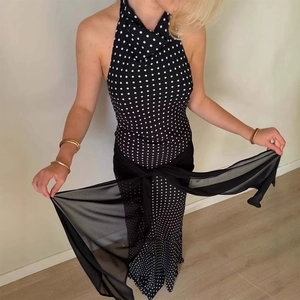 Detail showing sheer black mesh waist tie on polka dot halter dress for women