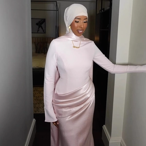 Slim fit light pink satin maxi dress with elegant pleats and long sleeves for parties