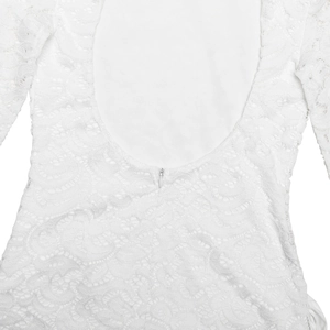 Close-up of white jacquard lace dress featuring an open back design and invisible zipper