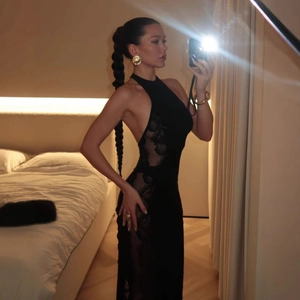 Detailed view of sheer black floral lace panels on a slim fit halter evening gown