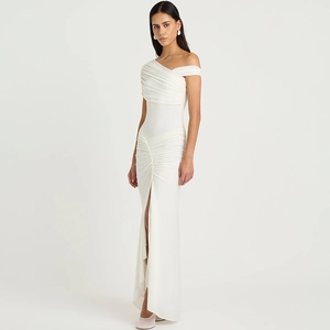 Detail of elegant white off-shoulder gown with horizontal ruching and side slit