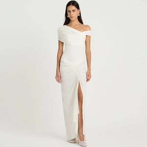 Macro detail of the white off-shoulder ruched dress with an elegant side slit