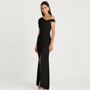 Detail of elegant off-shoulder ruching and high slit on a black evening gown